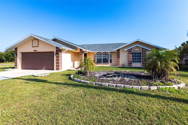 single story home with concrete driveway, a garage, a front yard, and stucco siding