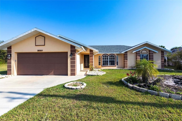 ranch-style home with stucco siding, a front yard, a garage, and driveway