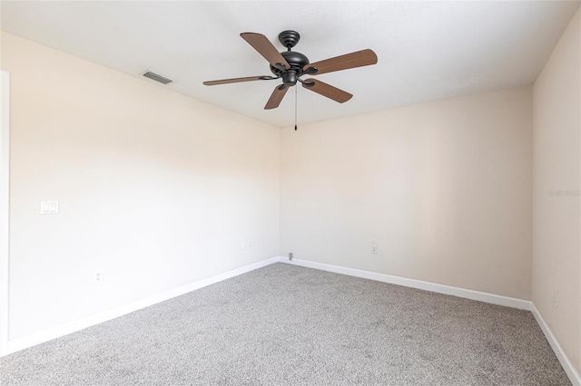 unfurnished room featuring a ceiling fan, carpet, visible vents, and baseboards