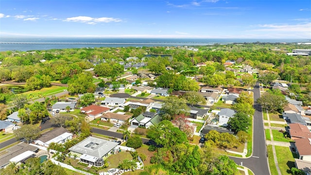 birds eye view of property with a residential view and a water view