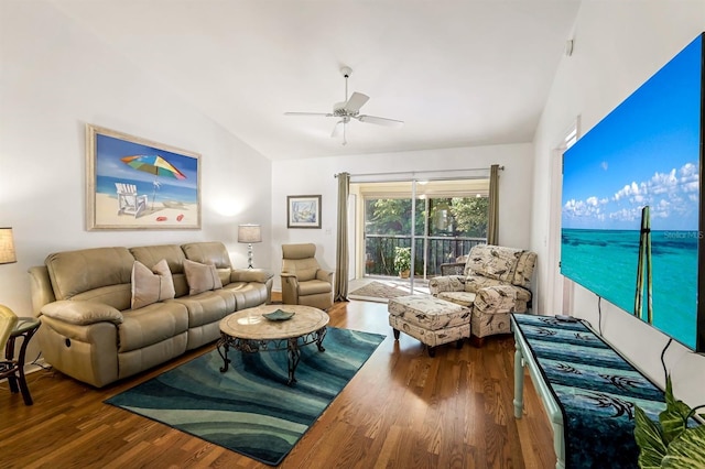 living room featuring lofted ceiling, ceiling fan, and dark wood-style flooring