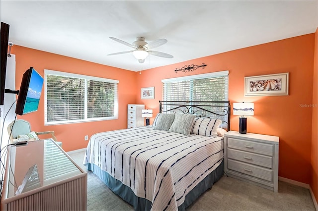 bedroom featuring carpet flooring, a ceiling fan, and baseboards