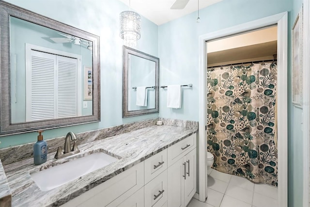 bathroom featuring a shower with shower curtain, toilet, vanity, and tile patterned flooring