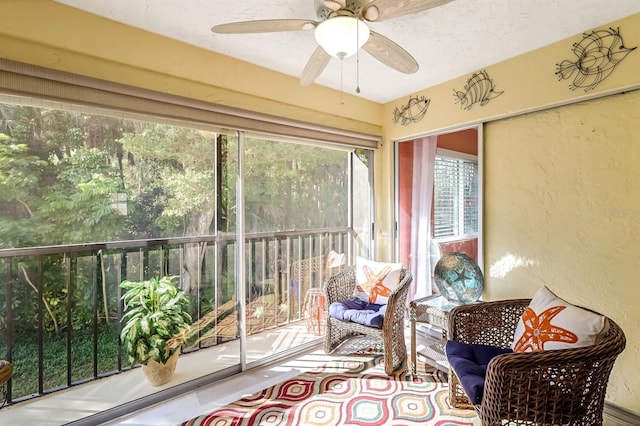 sunroom featuring ceiling fan