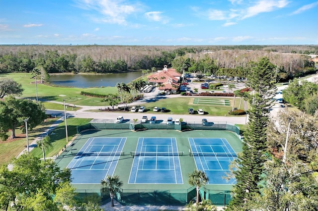 aerial view with a forest view and a water view