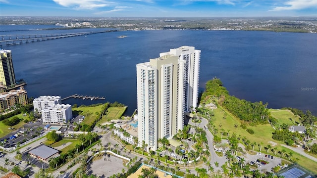 birds eye view of property with a view of city and a water view