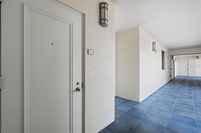 doorway to property with stucco siding