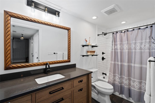 full bath with visible vents, shower / bath combo with shower curtain, toilet, recessed lighting, and vanity