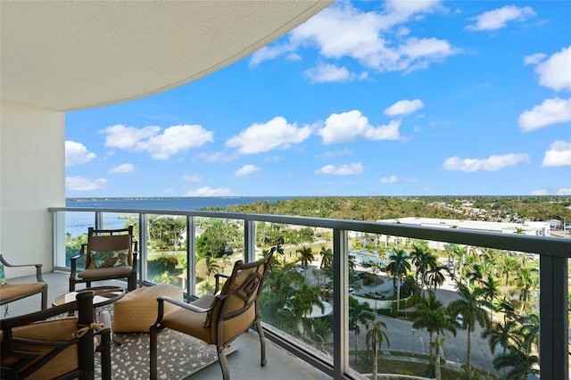 balcony featuring a water view