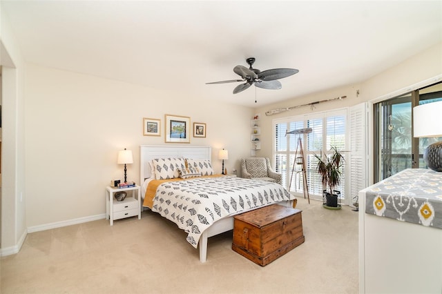 carpeted bedroom featuring baseboards, a ceiling fan, and access to outside