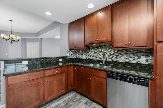 kitchen with backsplash, light wood-type flooring, a peninsula, stainless steel dishwasher, and a sink