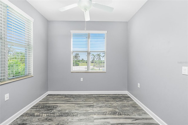 spare room with ceiling fan, baseboards, and wood finished floors