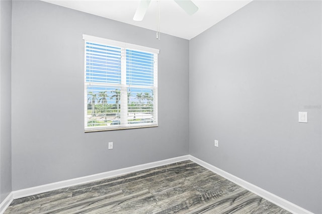 unfurnished room with wood finished floors, baseboards, and ceiling fan