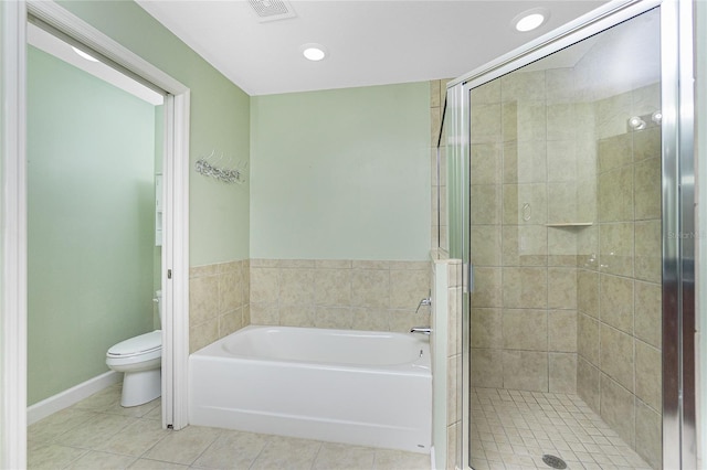 bathroom with visible vents, tile patterned flooring, a shower stall, a garden tub, and toilet