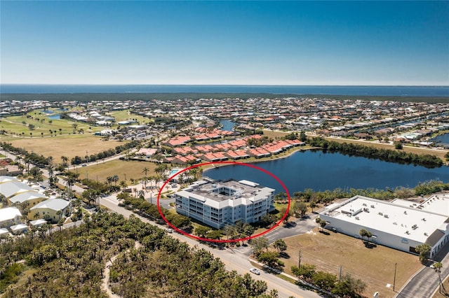 birds eye view of property featuring a water view