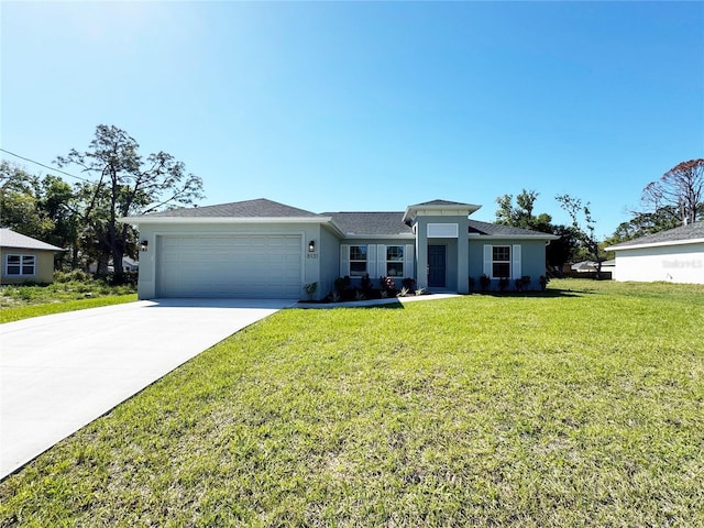 view of front of home with a front lawn, an attached garage, driveway, and stucco siding