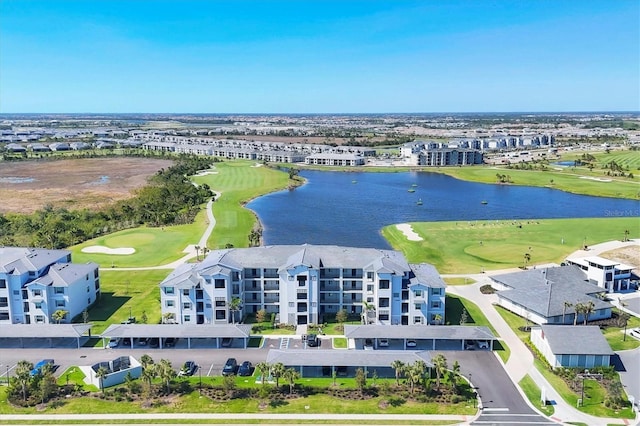 aerial view featuring view of golf course and a water view