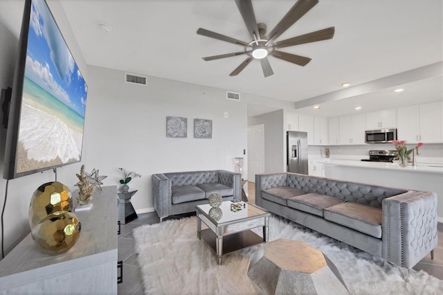 living area featuring light tile patterned floors, visible vents, recessed lighting, and a ceiling fan