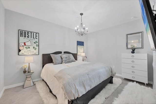 bedroom with light tile patterned floors, baseboards, and a chandelier