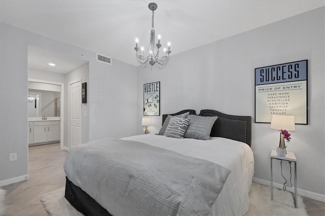 bedroom with visible vents, a notable chandelier, ensuite bath, light tile patterned floors, and baseboards