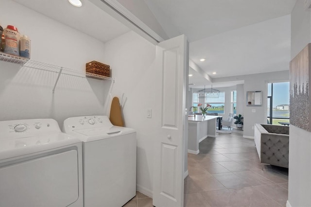 washroom with baseboards, washing machine and dryer, laundry area, recessed lighting, and light tile patterned flooring