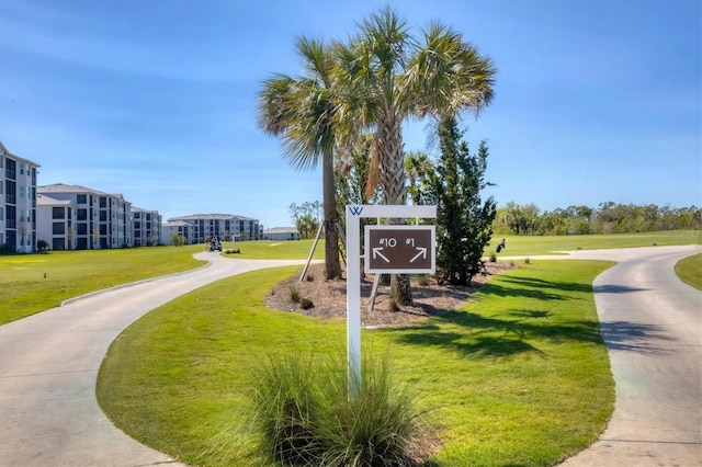 surrounding community featuring a lawn