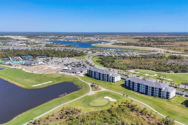 aerial view featuring view of golf course and a water view