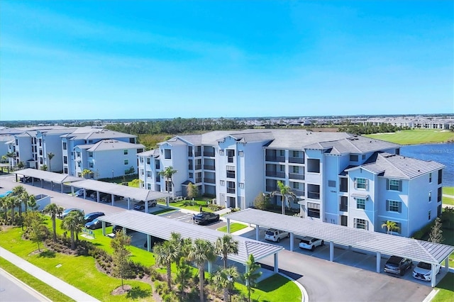 birds eye view of property with a water view