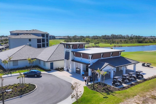 birds eye view of property with a water view