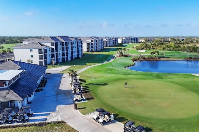 aerial view with a water view and view of golf course