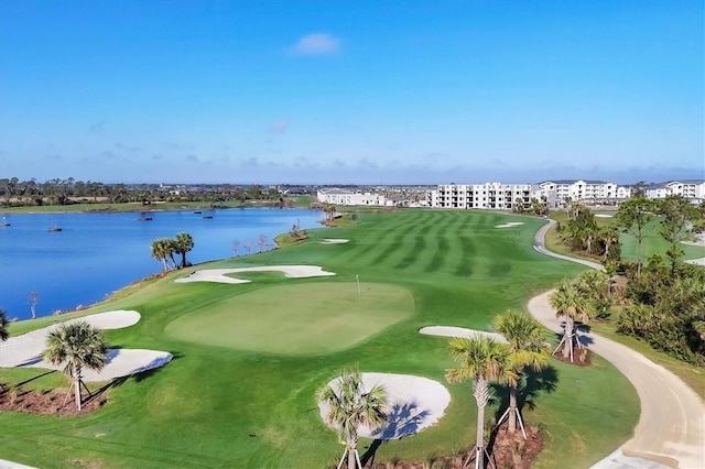 view of community with view of golf course and a water view