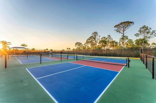 view of sport court featuring fence