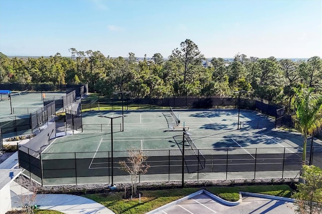 view of tennis court with fence