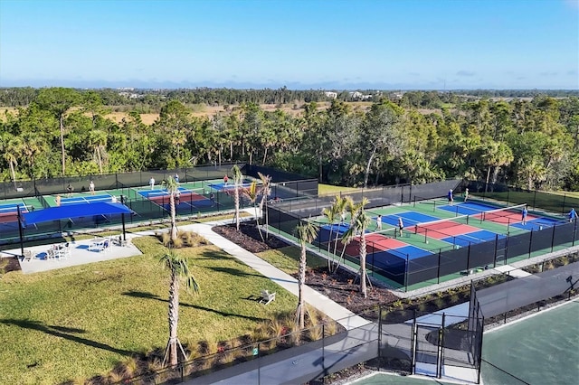 drone / aerial view with a wooded view