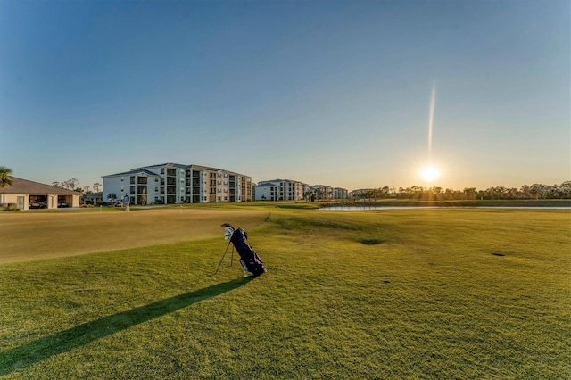 view of property's community with a lawn