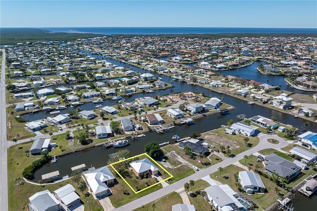 aerial view with a residential view and a water view