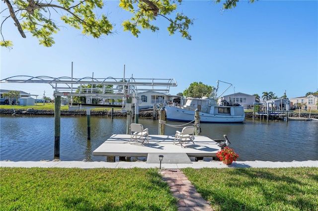 view of dock with a residential view and a water view