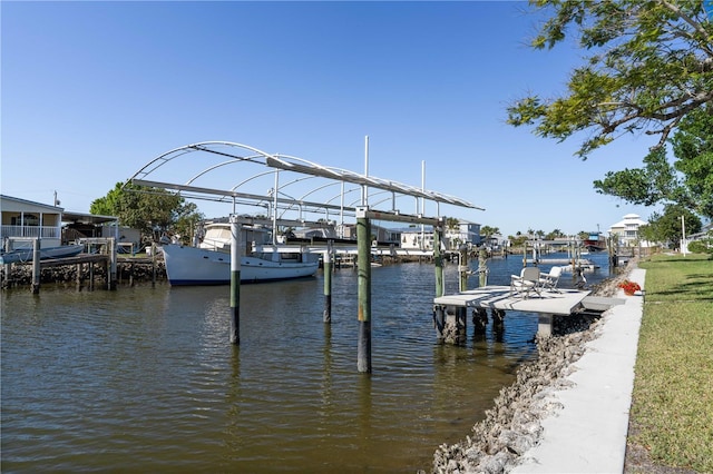 view of dock featuring boat lift and a water view