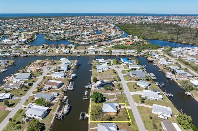 bird's eye view with a residential view and a water view