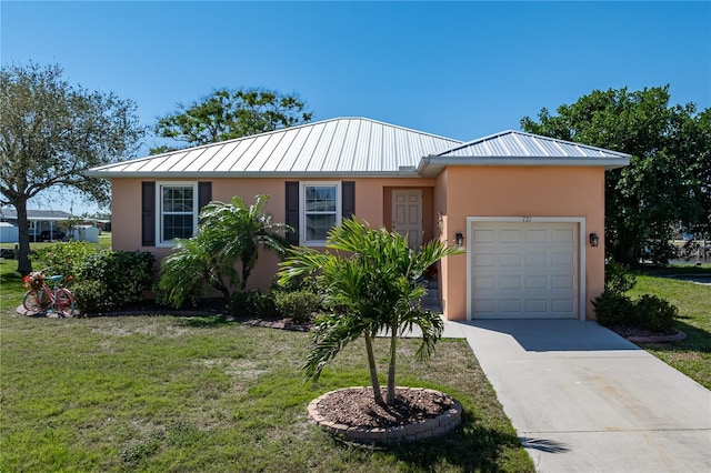 single story home featuring a front lawn, an attached garage, and stucco siding