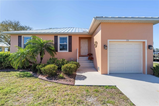 ranch-style house featuring stucco siding, an attached garage, driveway, and a front yard