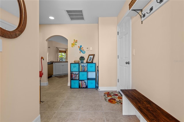 rec room featuring arched walkways, visible vents, and baseboards