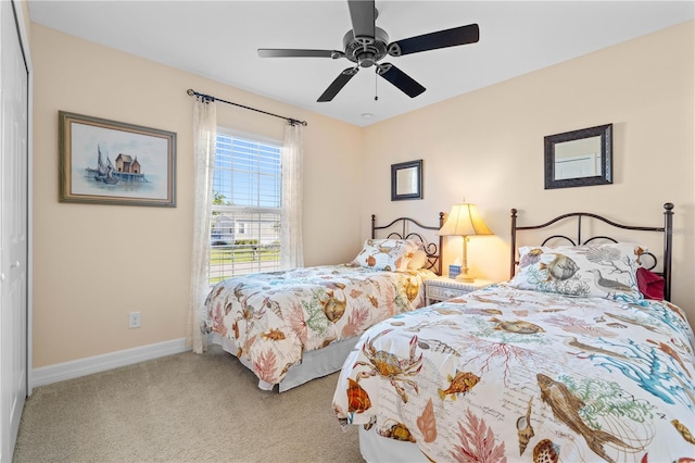 bedroom featuring carpet, baseboards, and ceiling fan