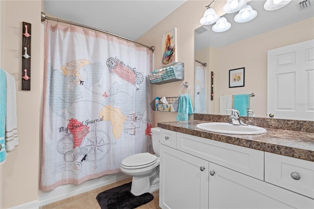 bathroom featuring visible vents, toilet, vanity, and tile patterned flooring