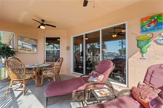 view of patio featuring outdoor dining area and ceiling fan