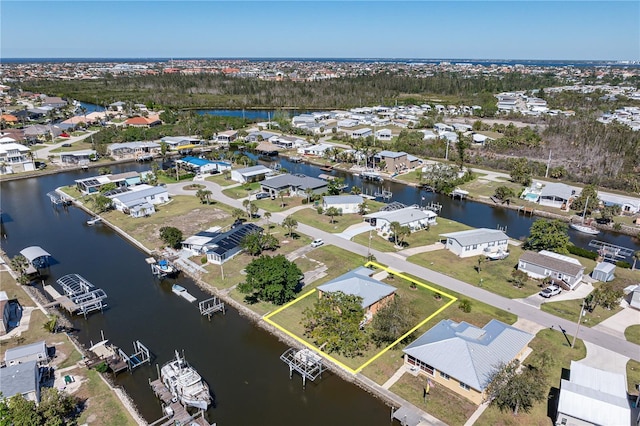 bird's eye view featuring a residential view and a water view