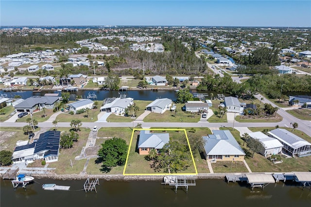 birds eye view of property featuring a residential view and a water view