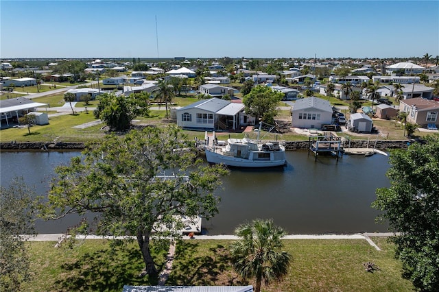 bird's eye view with a residential view and a water view