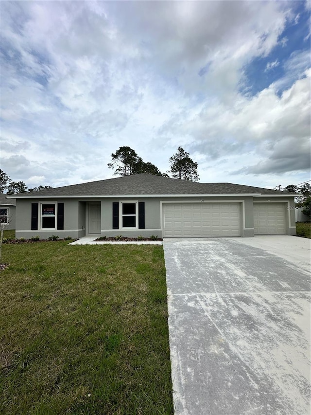 ranch-style house featuring stucco siding, driveway, a front lawn, and a garage