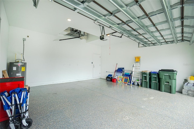 garage featuring a garage door opener and water heater